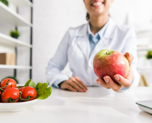 Dietician holding an apple