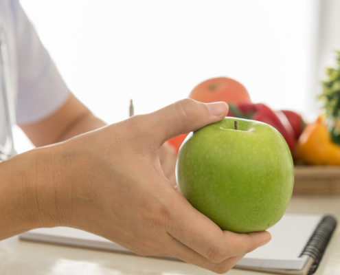 Dietitian holding an apple